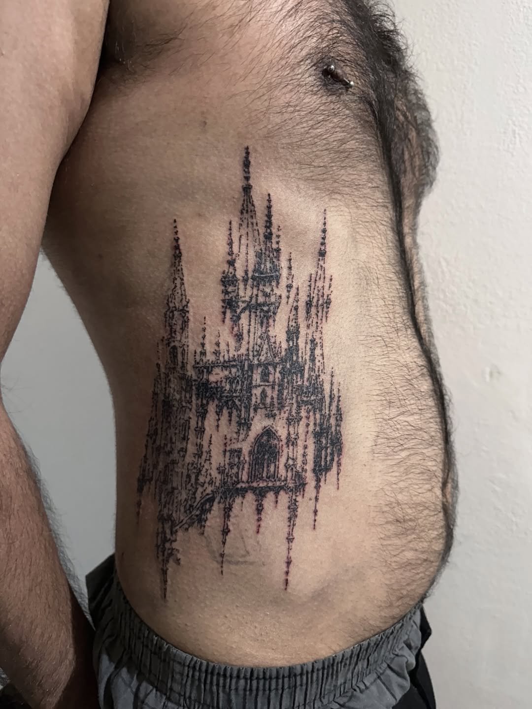 Blackwork cathedral tattoo on ribs by Emoitaliano